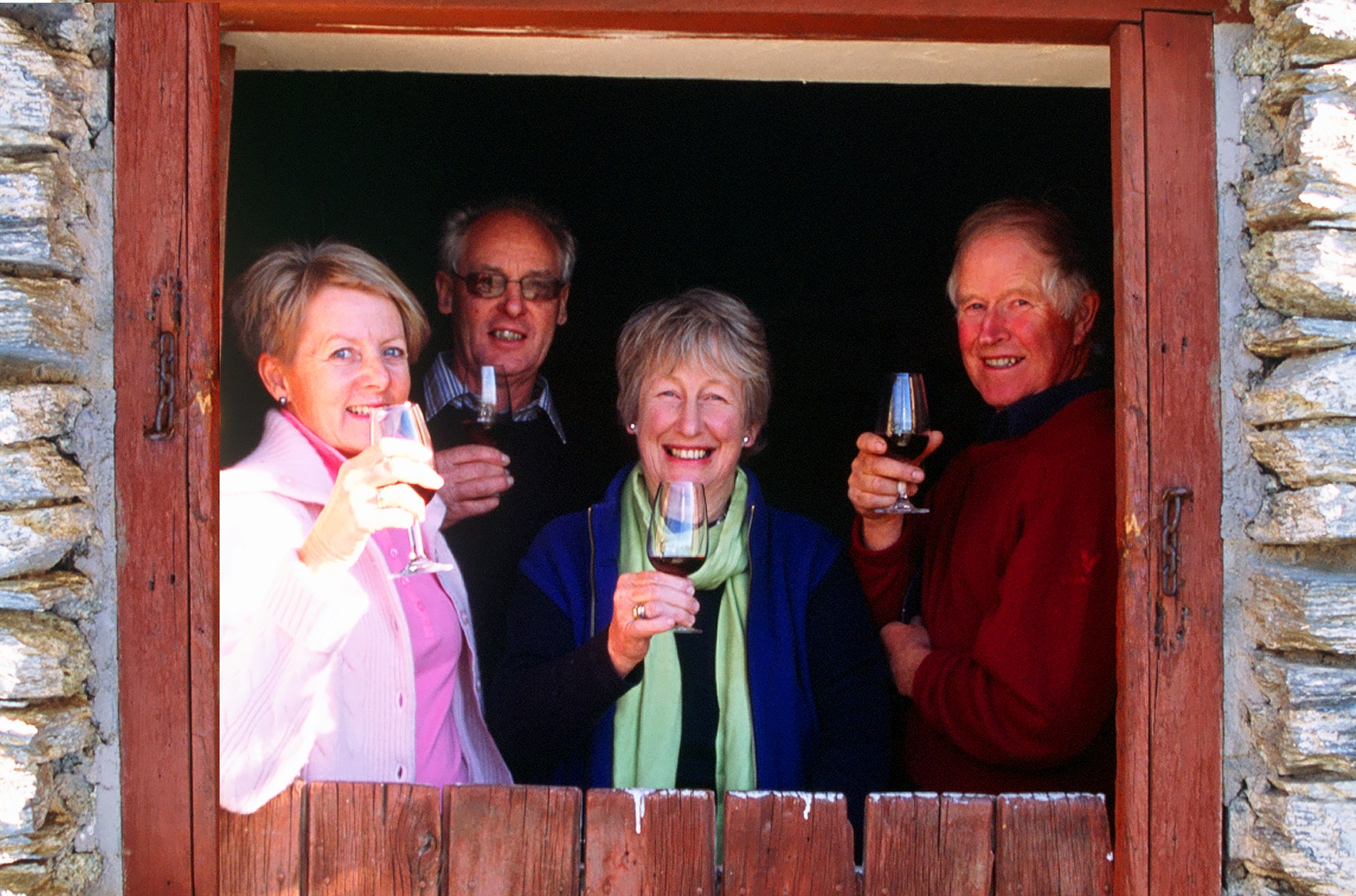 Friends enjoying wine tasting in Central Otago with Wanaka Wine Tours in New Zealand